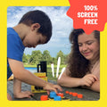 Kids enjoying 100% screen-free entertainment with GiiKER Tic-Tac-Toe in the park.